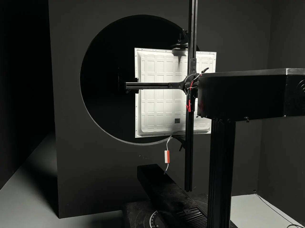 Lighting panel undergoing testing in the specialized dark room