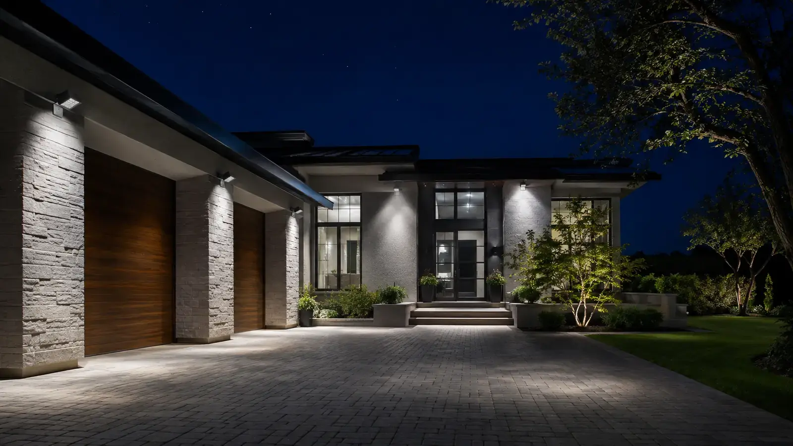 Floodlights illuminating a contemporary private house at night